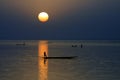 Horizontal silhouette of canoes on Niger River