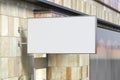 Horizontal singboard or signage on the white wall with blank black sign mock up. Side view Royalty Free Stock Photo