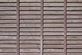 Horizontal texture of a wall from several rows of brown old wooden boards. Painted wooden wall in brown colo Royalty Free Stock Photo