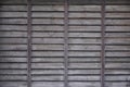 Horizontal texture of a wall from several rows of brown old wooden boards. Painted wooden wall in brown colo Royalty Free Stock Photo