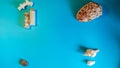 Horizontal top angle shot of various big and small seashells randomly placed on a blue surface Royalty Free Stock Photo