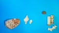 Horizontal top angle shot of various big and small seashells randomly placed on a blue surface Royalty Free Stock Photo