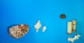 Horizontal top angle shot of various big and small seashells randomly placed on a blue surface Royalty Free Stock Photo