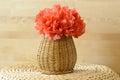 Horizontal Vase basket with red tissue paper flowe