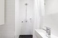 Horizontal verion of white ensuite bathroom in renovated home