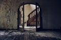 Horizontal view of an abandoned building with an arch and a staircase behind it Royalty Free Stock Photo