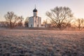 Horizontal view of an ancient church at dawn, a frosty morning, early spring