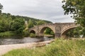 Horizontal view of Barden Bridge as it crosses the River Wharfe near Bolton Abbey in Yorkshire Royalty Free Stock Photo