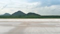 Horizontal view of empty concrete road with dust and grass. Royalty Free Stock Photo