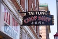 Horizontal view of the hanging sign of Tai Tung Restaurant, the oldest Chinese restaurant in