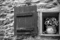 Horizontal View of a Little Open Window With a Flowered Pot in G