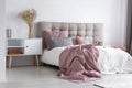 Pastel pink cozy bedroom with grey accents Royalty Free Stock Photo