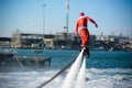 Horizontal View of Santa Claus on Flyboard on Blur Background