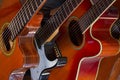 Horizontal view of several types of studio guitars ready to by played by musicians. Royalty Free Stock Photo