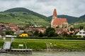 Horizontal view of the village of Weissenkirchen built along the Danube River.