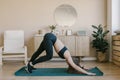 Horizontal view of a woman doing yoga at home Royalty Free Stock Photo