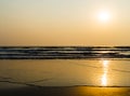 Horizontal vivid golden tidal waves with sun reflection