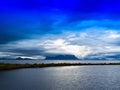 Horizontal vivid Norway fjord ocean bay with dramatic clouds bac