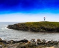 Horizontal vivid Norway right aligned lighthouse on rocky island Royalty Free Stock Photo