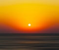 Horizontal vivid orange sunset ocean horizon abstraction blur ba Royalty Free Stock Photo