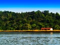 Horizontal vivid right aligned indian house on river