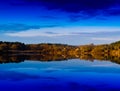 Horizontal vivid vibrant dramatic house on river reflections l Royalty Free Stock Photo