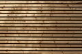 Horizontal wooden slats with gaps, background