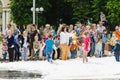 HORKI, BELARUS - JULY 25, 2018: Children of different ages play with airy white foam at the Rescue Service 112 holiday amid a crow