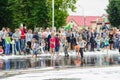 HORKI, BELARUS - JULY 25, 2018: Children of different ages play with airy white foam at the Rescue Service 112 holiday amid a crow