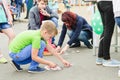 HORKI, BELARUS - JULY 25, 2018: Children of different ages play on a holiday in the park on a summer day in a crowd of people