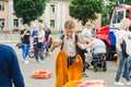 HORKI, BELARUS - JULY 25, 2018: Girl dress the uniform of lifeguards of service 112 at a party in the park in the summer day