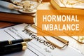 Hormonal imbalance concept. Medical documents on desk. Royalty Free Stock Photo