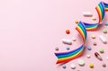 Hormone pills after sex change. Transgender transition. Transvestite. Pride LGBT rainbow ribbon and pills on pink