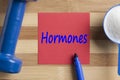 Hormones written on note