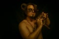 Faun with panflute Royalty Free Stock Photo