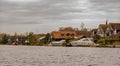 Luxurious waterside rental properties and boats on the bank of the River Bure in the village of Horning