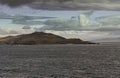 Hornos island of Wollaston archipelago under cloudscape, Cape Horn, Chile Royalty Free Stock Photo