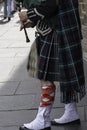 An hornpipe player, in its traditional Scottish Kilt, performing live in Royal Mile street, Edinburgh downtown