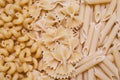 Horns, feathers, bows pasta or macaroni background, texture Royalty Free Stock Photo