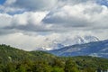 Horns of torres del paine towering over a mountain ridge with dark green forest. Royalty Free Stock Photo