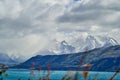 Horns of torres del paine towering over the turquoise water of lake Pehoe and a mountain ridge. Royalty Free Stock Photo