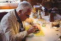 Horologist repairing a watch