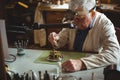 Horologist repairing a watch