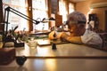 Horologist repairing a watch