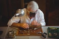 Horologist repairing a watch