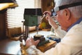 Horologist repairing a watch