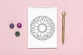 Horoscope circle with twelve signs of zodiac on paper, divination dice, colorful stone on pink background Fortune telling and