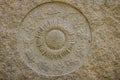 Horoscope wheel chart made from marble stone. Ancient stone zodiac wheel with signs around the sun symbol.