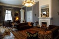 Horovice castle interior, Baroque chateau, carved wooden furniture in guest salon with sofa and armchairs, marble fireplace,