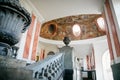 Horovice castle interior, Baroque chateau, Large bright hall of the castle with marble staircase and frescoes on the ceiling,